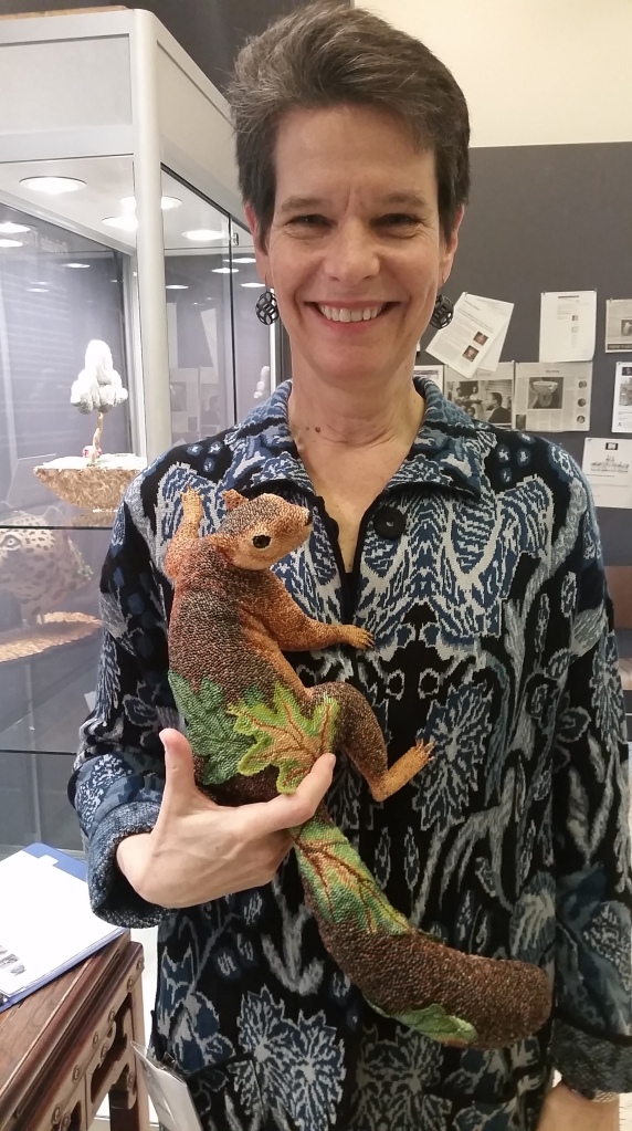 Leslie B Grigsby with one of her beadwork creatures